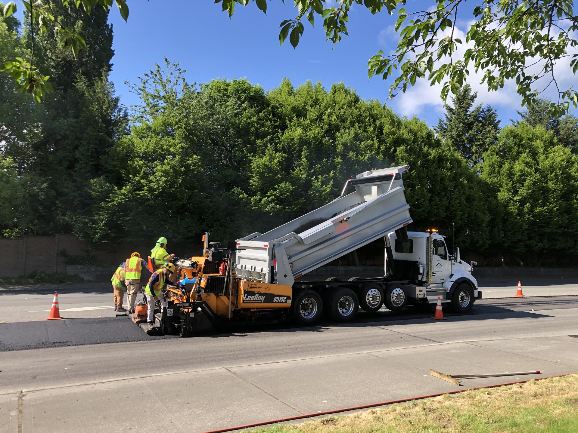 Paving crew completing repairs on roadway in Kent