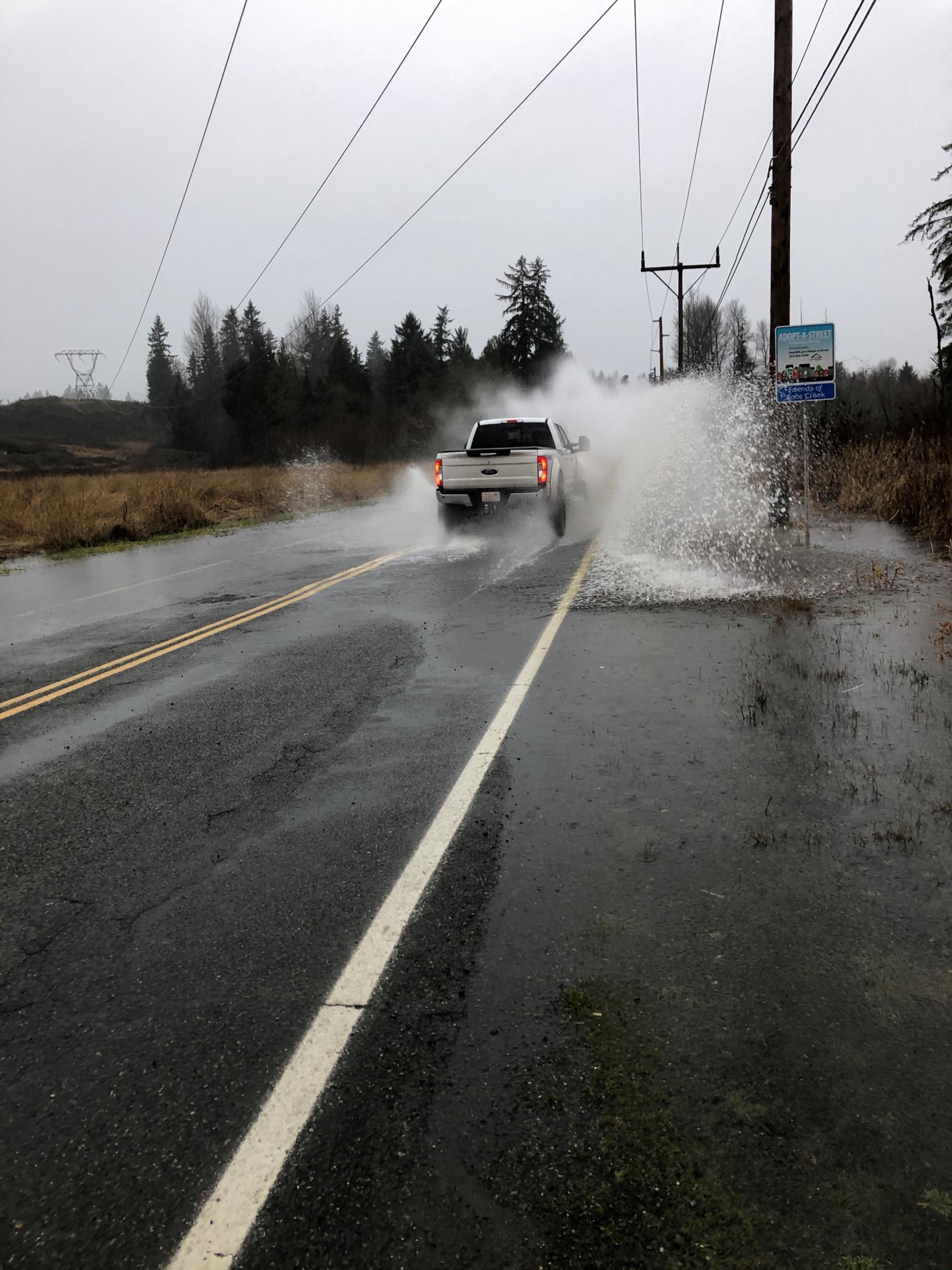 Vehicle driving through flood waters