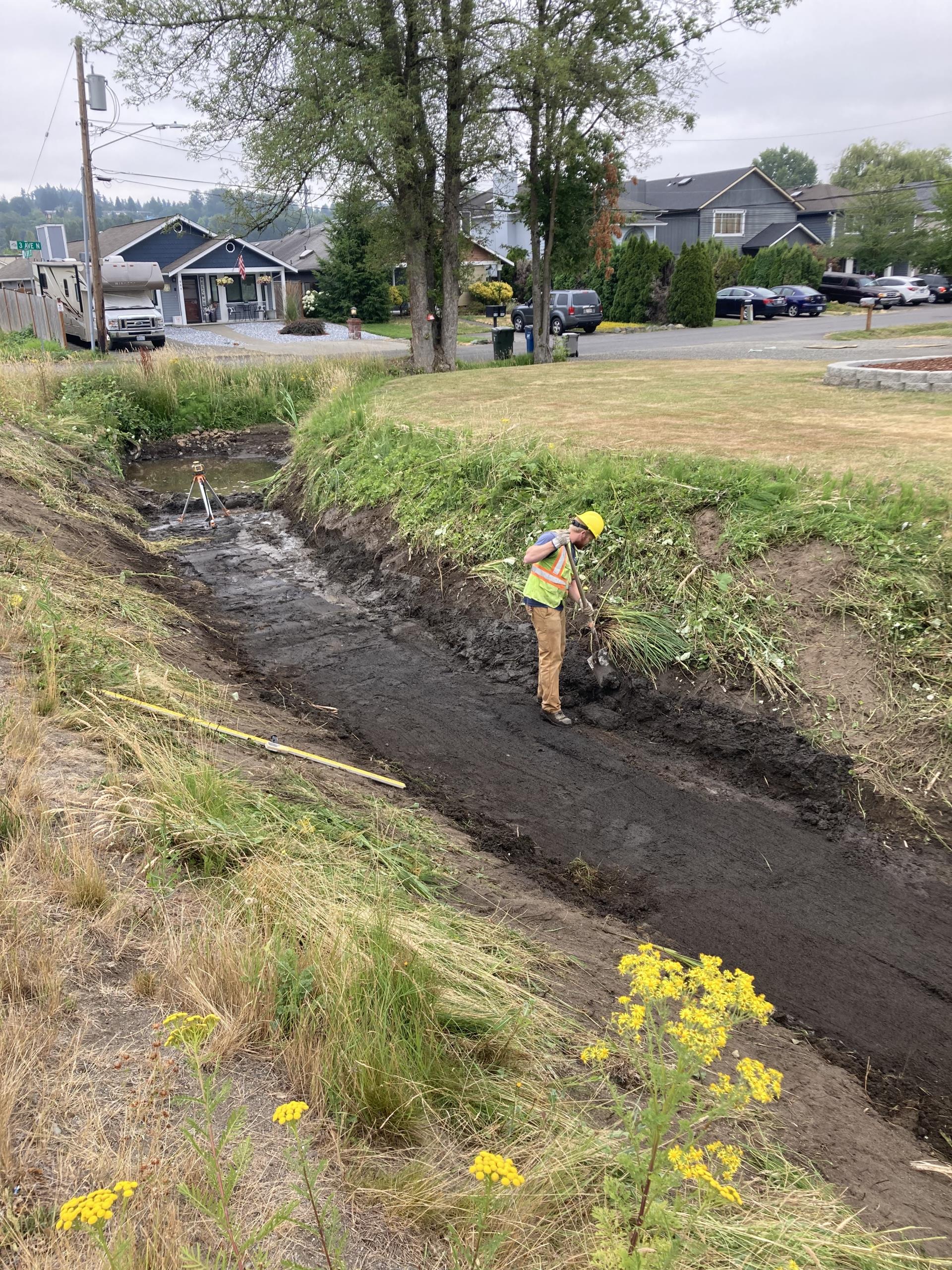 Staff re-establishing and shaping ditch