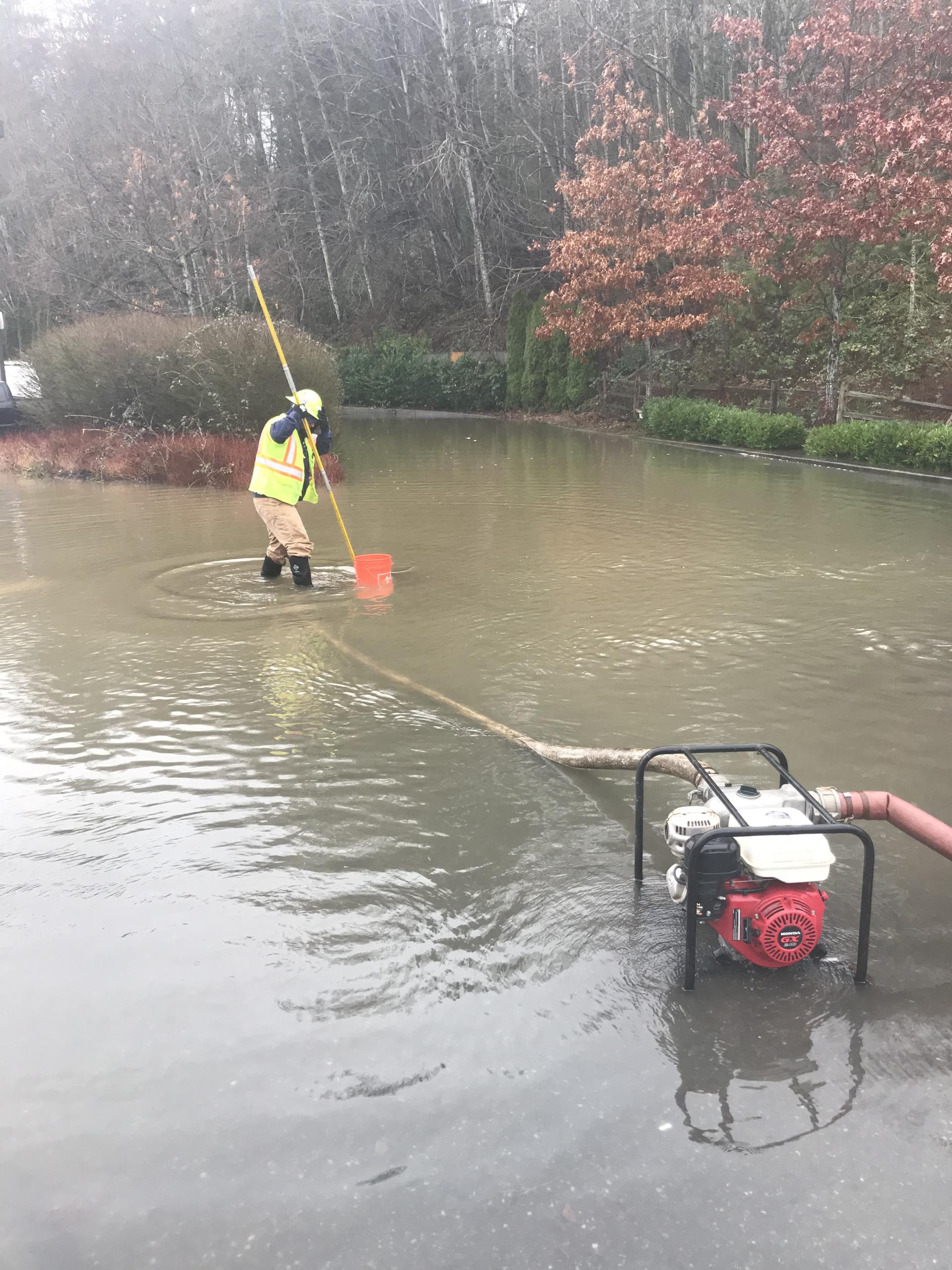 Staff assisting with pumping for flooding