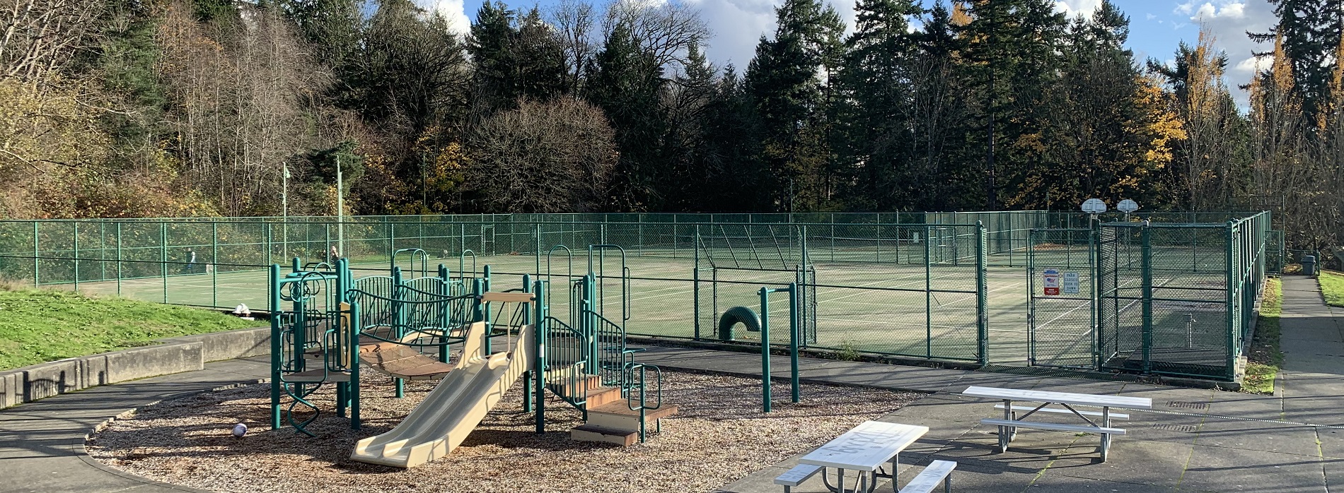 play equipment and tennis court