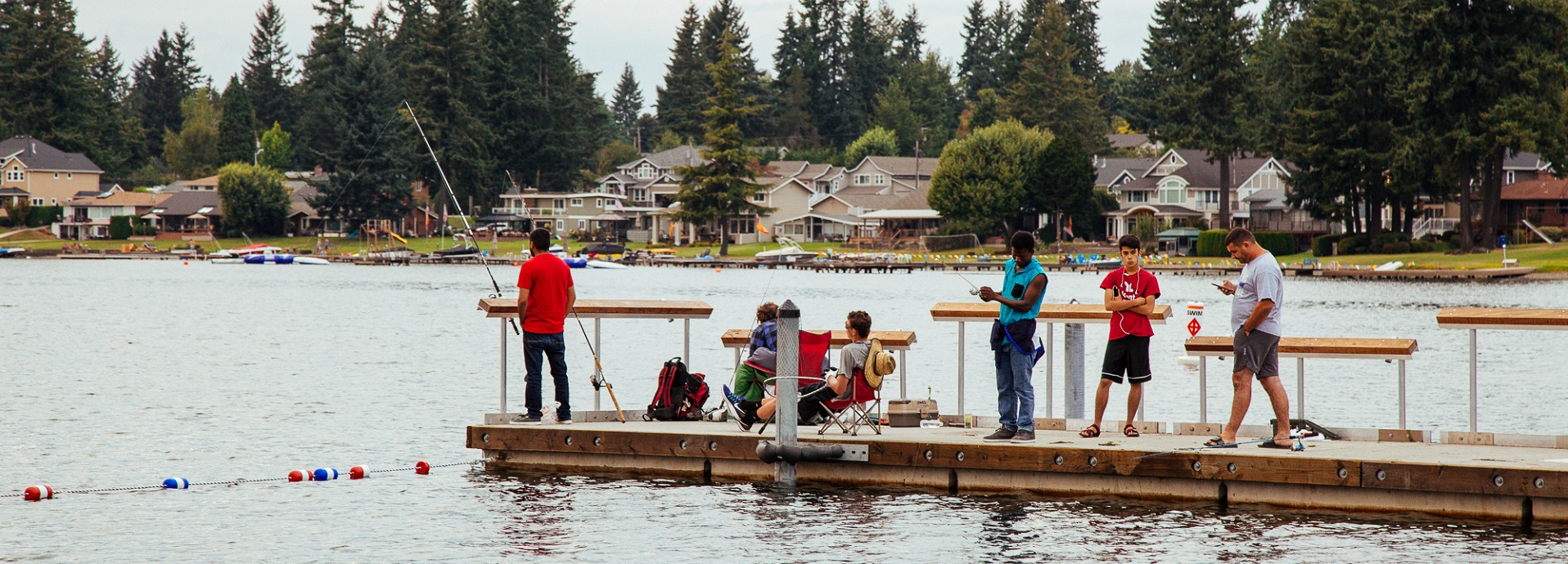 People fishing from a floating pier