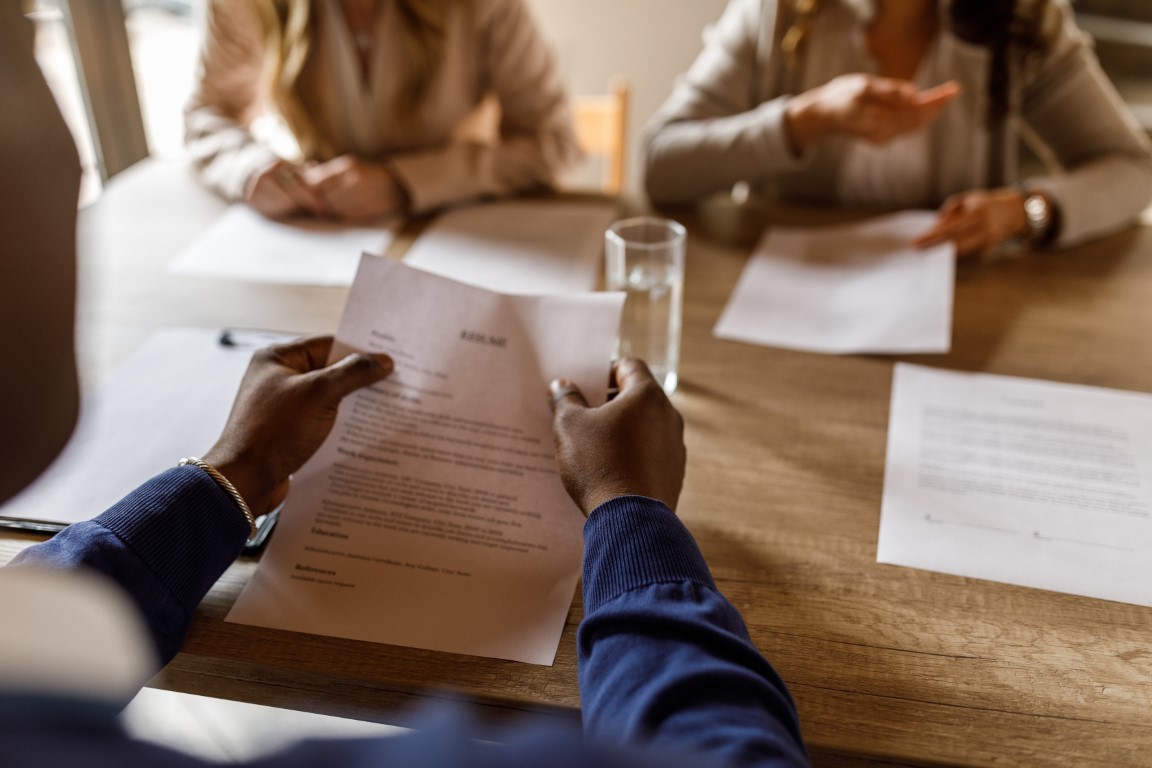 Image of three people at a table